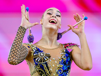 Natalya Usova of Uzbekistan competes in the Clubs final of the International Rhythmic Gymnastics Tournament ''Sky Grace 2024'' at Aspire Zon...