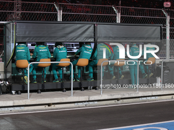 The Aston Martin team observes data screens while Fernando Alonso drives in the third Free Practice session of the Formula 1 Heineken Silver...