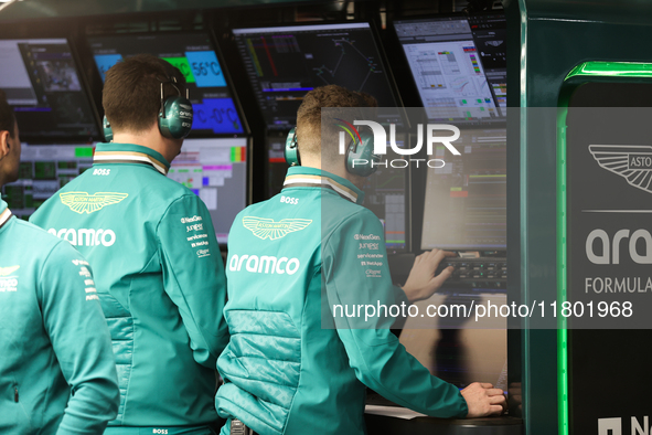 The Aston Martin team observes data screens during the third Free Practice session of the Formula 1 Heineken Silver Las Vegas Grand Prix in...