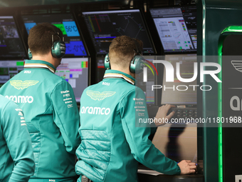 The Aston Martin team observes data screens during the third Free Practice session of the Formula 1 Heineken Silver Las Vegas Grand Prix in...