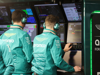 The Aston Martin team observes data screens during the third Free Practice session of the Formula 1 Heineken Silver Las Vegas Grand Prix in...