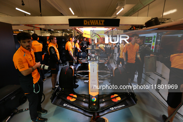 The McLaren team prepares in the garage ahead of Oscar Piastri's drive in the third Free Practice session of the Formula 1 Heineken Silver L...