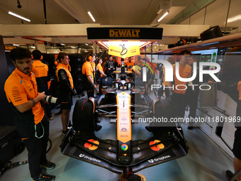 The McLaren team prepares in the garage ahead of Oscar Piastri's drive in the third Free Practice session of the Formula 1 Heineken Silver L...