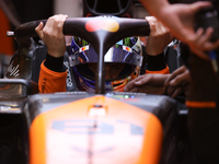 The McLaren team prepares in the garage ahead of Oscar Piastri's drive in the third Free Practice session of the Formula 1 Heineken Silver L...