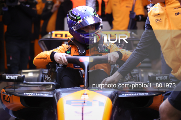 The McLaren team prepares in the garage ahead of Oscar Piastri's drive in the third Free Practice session of the Formula 1 Heineken Silver L...