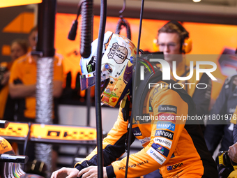 The McLaren team prepares in the garage ahead of Oscar Piastri's drive in the third Free Practice session of the Formula 1 Heineken Silver L...