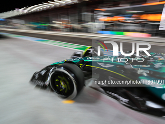 Lance Stroll drives in the pit lane garage during the third Free Practice session of the Formula 1 Heineken Silver Las Vegas Grand Prix in L...