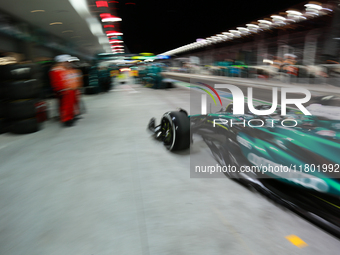 Lance Stroll drives in the pit lane garage during the third Free Practice session of the Formula 1 Heineken Silver Las Vegas Grand Prix in L...