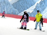 Tourists ski at the Kunlewan International Tourism Resort Ski Center in Handan, North China's Hebei province, on November 23, 2024. (