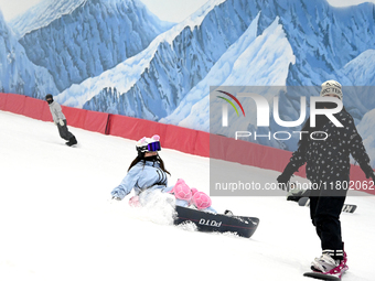 Tourists ski at the Kunlewan International Tourism Resort Ski Center in Handan, North China's Hebei province, on November 23, 2024. (