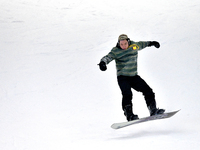 Tourists ski at the Kunlewan International Tourism Resort Ski Center in Handan, North China's Hebei province, on November 23, 2024. (