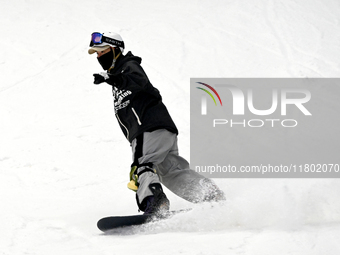 Tourists ski at the Kunlewan International Tourism Resort Ski Center in Handan, North China's Hebei province, on November 23, 2024. (