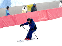 Tourists ski at the Kunlewan International Tourism Resort Ski Center in Handan, North China's Hebei province, on November 23, 2024. (