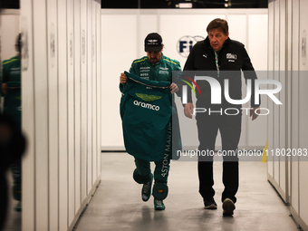 Fernando Alonso walks out of the FIA garage after qualifying during the Formula 1 Heineken Las Vegas Grand Prix in Las Vegas, Nevada. (