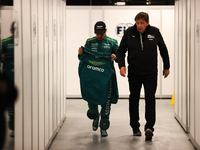 Fernando Alonso walks out of the FIA garage after qualifying during the Formula 1 Heineken Las Vegas Grand Prix in Las Vegas, Nevada. (