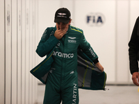 Fernando Alonso walks out of the FIA garage after qualifying during the Formula 1 Heineken Las Vegas Grand Prix in Las Vegas, Nevada. (