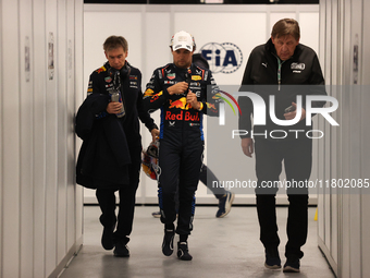 Sergio Perez walks out of the FIA garage after qualifying during the Formula 1 Heineken Las Vegas Grand Prix in Las Vegas, Nevada. (