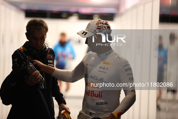 Sergio Perez walks out of the FIA garage after qualifying during the Formula 1 Heineken Las Vegas Grand Prix in Las Vegas, Nevada. 