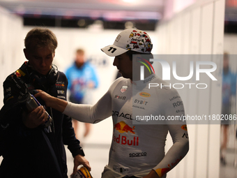 Sergio Perez walks out of the FIA garage after qualifying during the Formula 1 Heineken Las Vegas Grand Prix in Las Vegas, Nevada. (