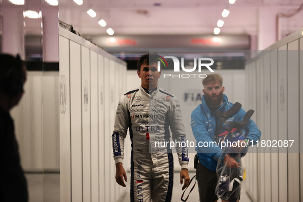 Alexander Albon walks out of the FIA garage after qualifying during the Formula 1 Heineken Las Vegas Grand Prix in Las Vegas, Nevada. 