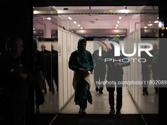 Lance Stroll walks out of the FIA garage after qualifying during the Formula 1 Heineken Las Vegas Grand Prix in Las Vegas, Nevada. (