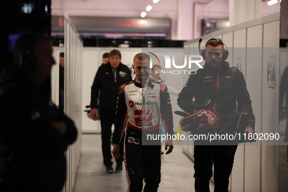 Kevin Magnussen walks out of the FIA garage after qualifying during the Formula 1 Heineken Las Vegas Grand Prix in Las Vegas, Nevada. 