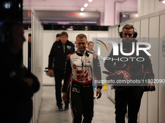 Kevin Magnussen walks out of the FIA garage after qualifying during the Formula 1 Heineken Las Vegas Grand Prix in Las Vegas, Nevada. (