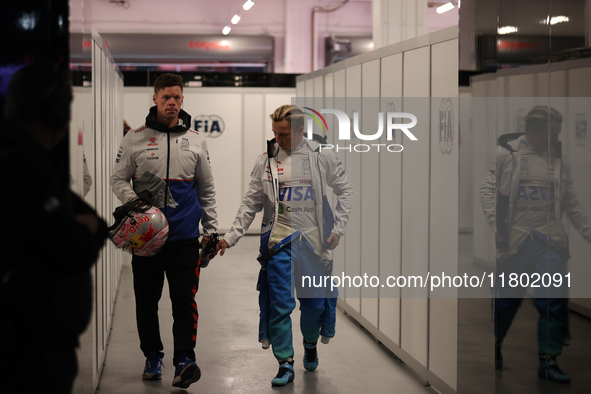 Liam Lawson walks out of the FIA garage after qualifying during the Formula 1 Heineken Las Vegas Grand Prix in Las Vegas, Nevada. 