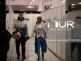 Liam Lawson walks out of the FIA garage after qualifying during the Formula 1 Heineken Las Vegas Grand Prix in Las Vegas, Nevada. (