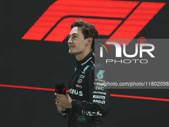 George Russell looks up at the crowd after placing first (P1) in Qualifying during the Formula 1 Heineken Las Vegas Grand Prix in Las Vegas,...