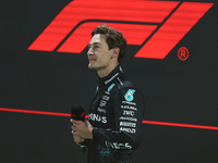 George Russell looks up at the crowd after placing first (P1) in Qualifying during the Formula 1 Heineken Las Vegas Grand Prix in Las Vegas,...