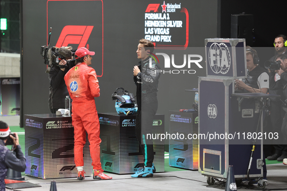 Carlos Sainz speaks to George Russell after qualifying during the Formula 1 Heineken Las Vegas Grand Prix in Las Vegas, Nevada, on November...