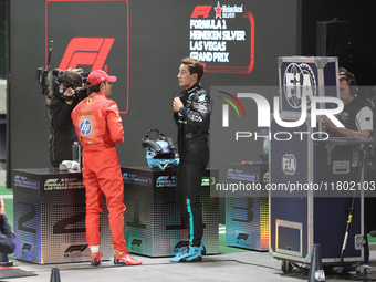 Carlos Sainz speaks to George Russell after qualifying during the Formula 1 Heineken Las Vegas Grand Prix in Las Vegas, Nevada, on November...