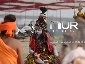 Indian Sadhus (Hindu holy men) gather during the Dharam Dhwaja (religious flag) ceremony at the Sangam area, ahead of the upcoming Maha Kumb...