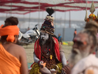 Indian Sadhus (Hindu holy men) gather during the Dharam Dhwaja (religious flag) ceremony at the Sangam area, ahead of the upcoming Maha Kumb...