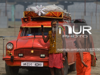 Indian Sadhus (Hindu holy men) gather during the Dharam Dhwaja (religious flag) ceremony at the Sangam area, ahead of the upcoming Maha Kumb...