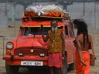 Indian Sadhus (Hindu holy men) gather during the Dharam Dhwaja (religious flag) ceremony at the Sangam area, ahead of the upcoming Maha Kumb...