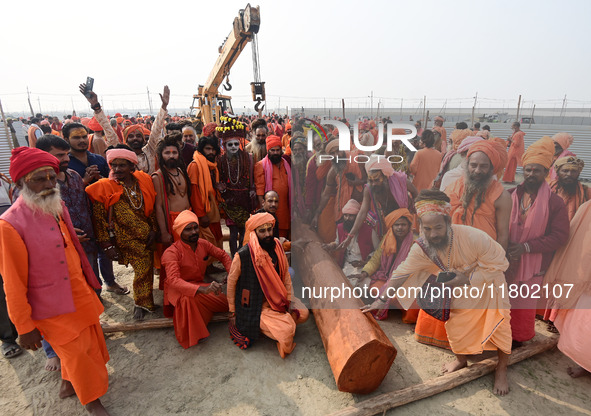 Indian Sadhus (Hindu holy men) gather during the Dharam Dhwaja (religious flag) ceremony at the Sangam area, ahead of the upcoming Maha Kumb...