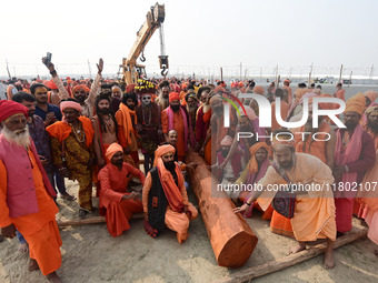 Indian Sadhus (Hindu holy men) gather during the Dharam Dhwaja (religious flag) ceremony at the Sangam area, ahead of the upcoming Maha Kumb...