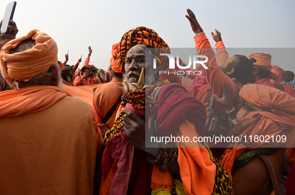 Indian Sadhus (Hindu holy men) gather during the Dharam Dhwaja (religious flag) ceremony at the Sangam area, ahead of the upcoming Maha Kumb...