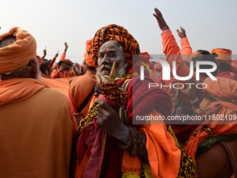 Indian Sadhus (Hindu holy men) gather during the Dharam Dhwaja (religious flag) ceremony at the Sangam area, ahead of the upcoming Maha Kumb...