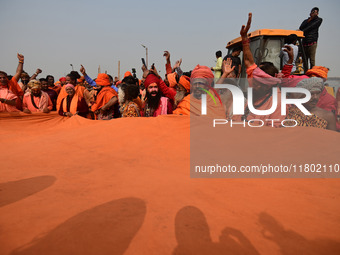 Indian Sadhus (Hindu holy men) gather during the Dharam Dhwaja (religious flag) ceremony at the Sangam area, ahead of the upcoming Maha Kumb...