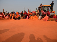 Indian Sadhus (Hindu holy men) gather during the Dharam Dhwaja (religious flag) ceremony at the Sangam area, ahead of the upcoming Maha Kumb...