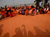 Indian Sadhus (Hindu holy men) gather during the Dharam Dhwaja (religious flag) ceremony at the Sangam area, ahead of the upcoming Maha Kumb...