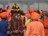 Indian Sadhus (Hindu holy men) gather during the Dharam Dhwaja (religious flag) ceremony at the Sangam area, ahead of the upcoming Maha Kumb...