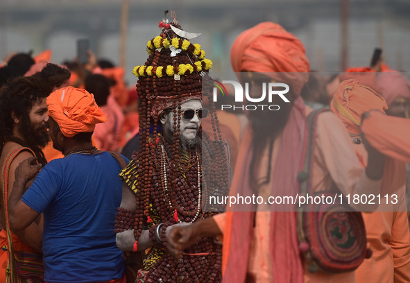 Indian Sadhus (Hindu holy men) gather during the Dharam Dhwaja (religious flag) ceremony at the Sangam area, ahead of the upcoming Maha Kumb...