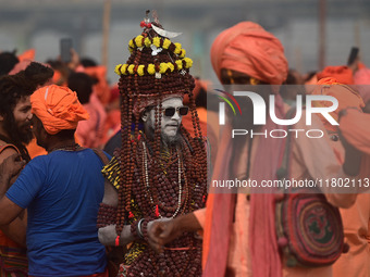 Indian Sadhus (Hindu holy men) gather during the Dharam Dhwaja (religious flag) ceremony at the Sangam area, ahead of the upcoming Maha Kumb...