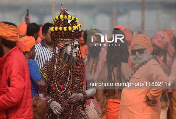 Indian Sadhus (Hindu holy men) gather during the Dharam Dhwaja (religious flag) ceremony at the Sangam area, ahead of the upcoming Maha Kumb...