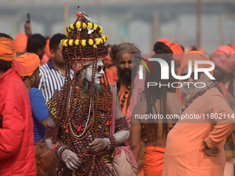 Indian Sadhus (Hindu holy men) gather during the Dharam Dhwaja (religious flag) ceremony at the Sangam area, ahead of the upcoming Maha Kumb...