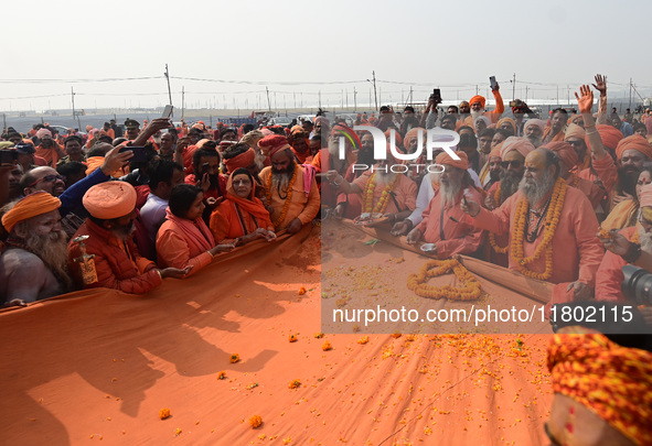 Indian Sadhus (Hindu holy men) gather during the Dharam Dhwaja (religious flag) ceremony at the Sangam area, ahead of the upcoming Maha Kumb...